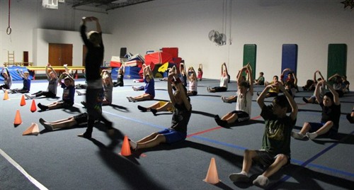Hands Above Head With Instructor